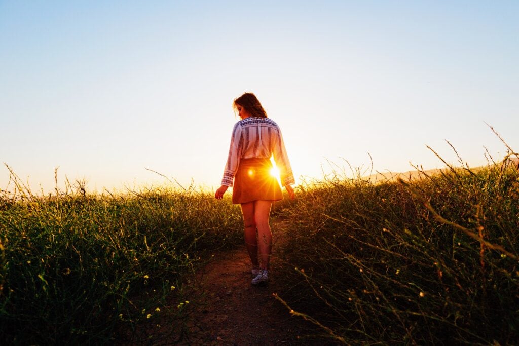 Woman walking along path