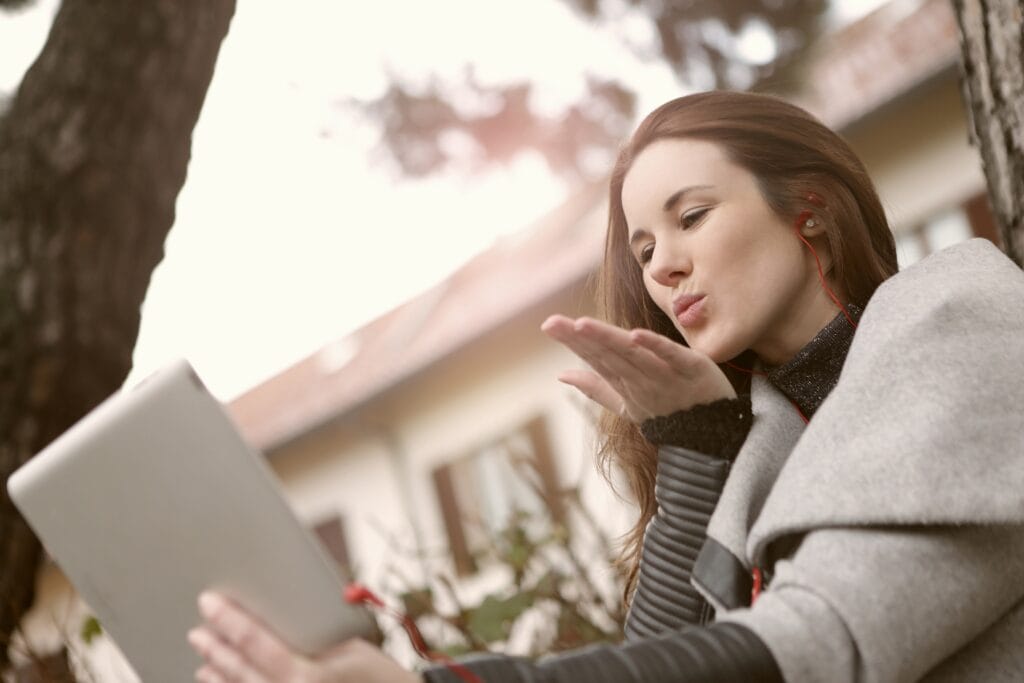 Woman talking to someone online.