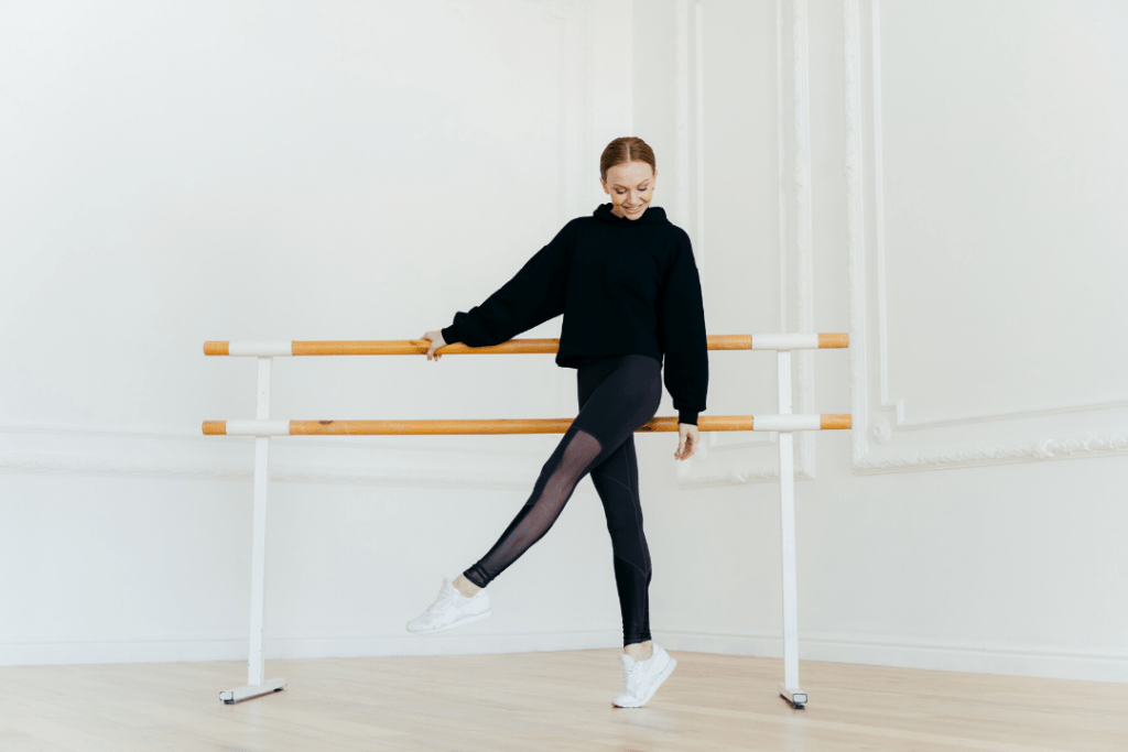 Woman doing a barre workout class