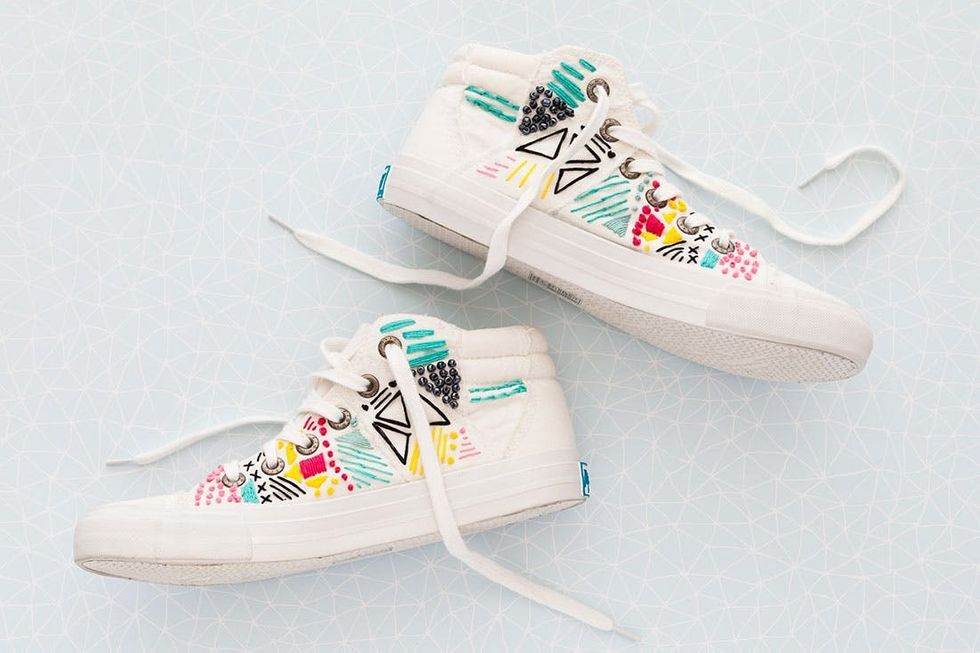 white sneakers with colored embroidery