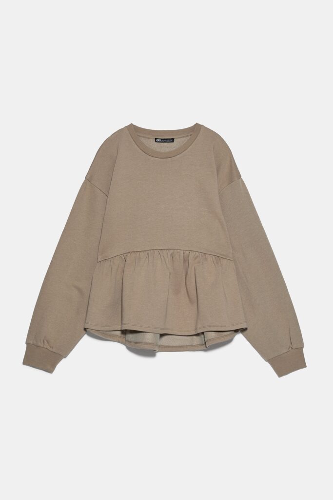 Peplum Sweatshirt in Khaki, shown against pale gray background