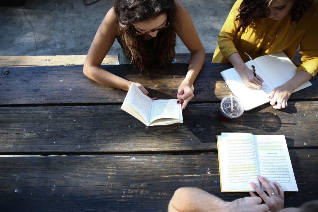 group of students studying outdoors