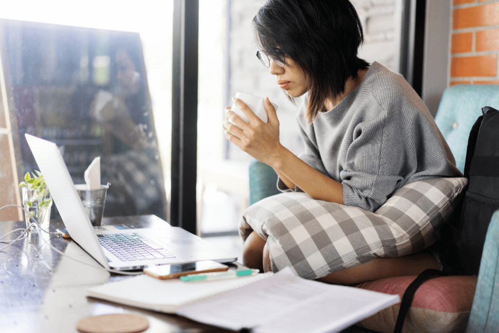 Things I learned in college - not being able to do everything. Photo of a woman working on multiple projects at a table