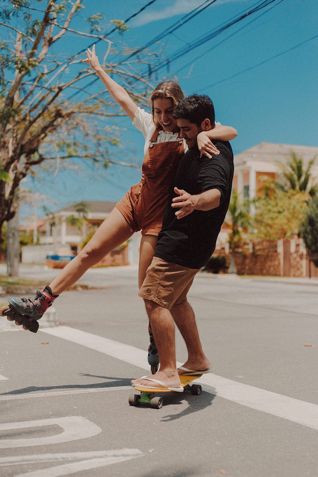 at home date ideasman and woman riding roller skates and on skateboardsource: Pexels