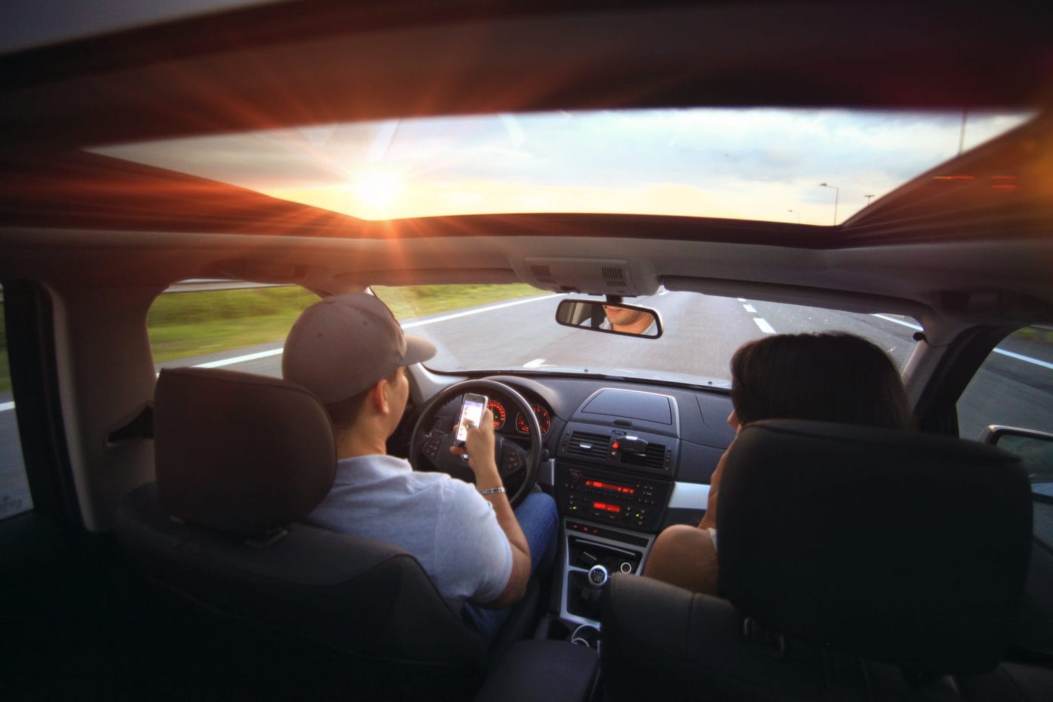 man and woman driving on road 
source: SplitShire from Pexels