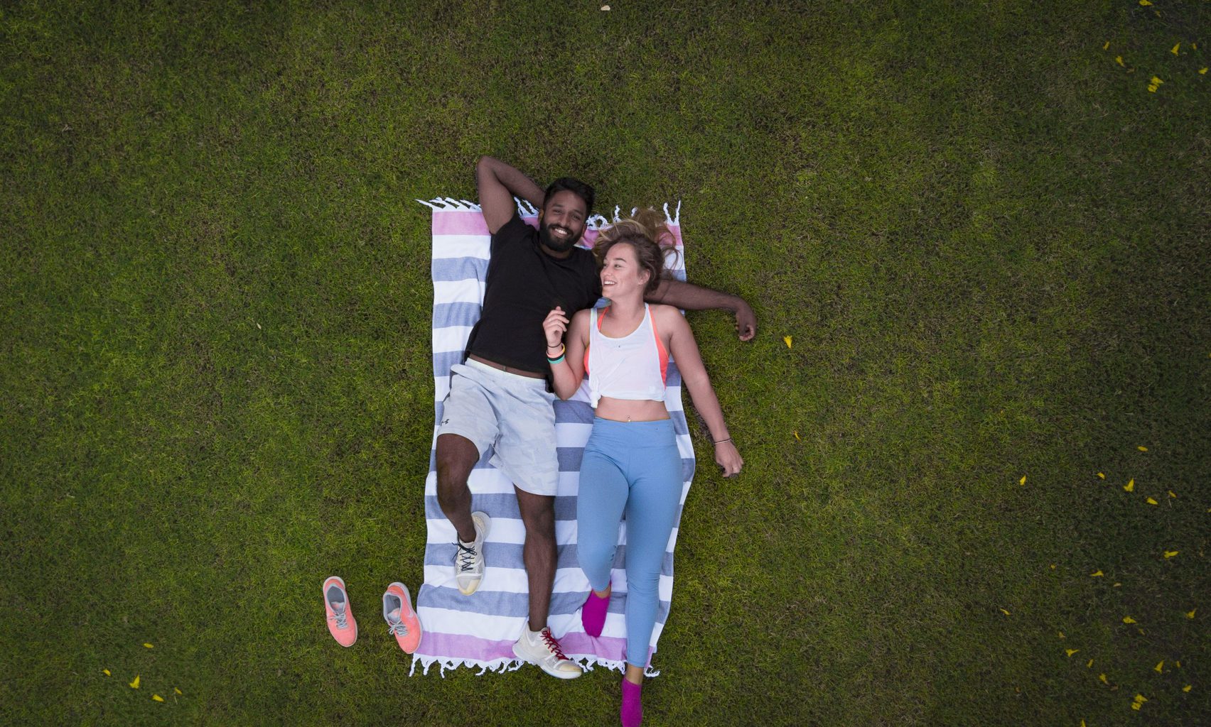 man and woman laying on rug staring upwardssource: thelazyartist from Pexels