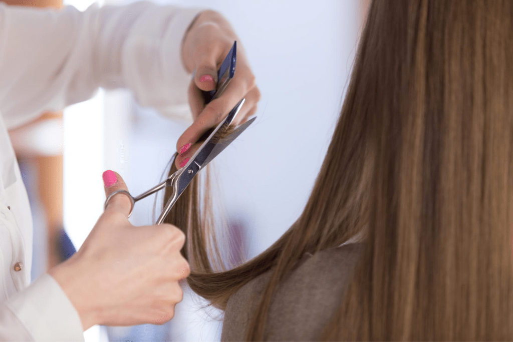 Woman getting her hair trimmed