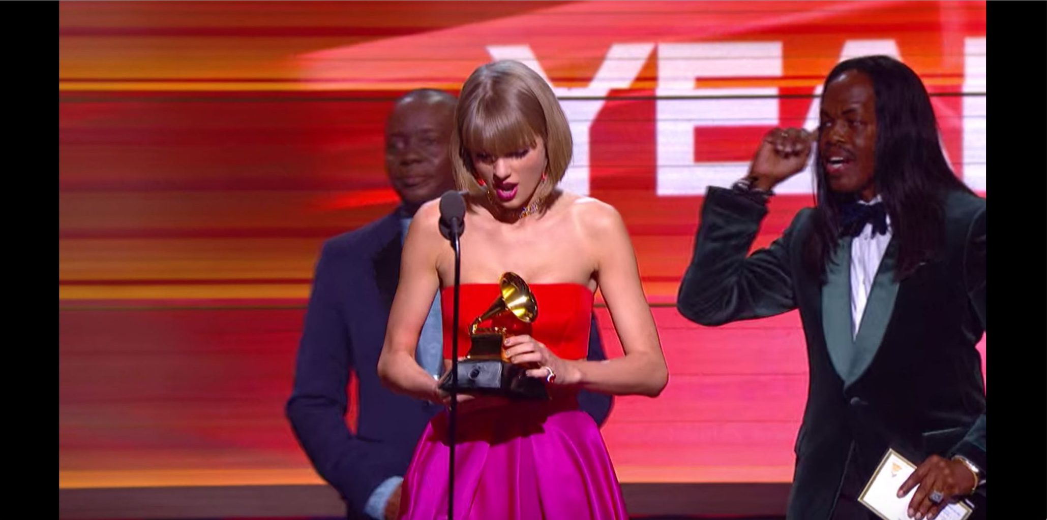 Miss Americana outfit -- Taylor Swift at the 2016 Grammys in a red top and pink skirt