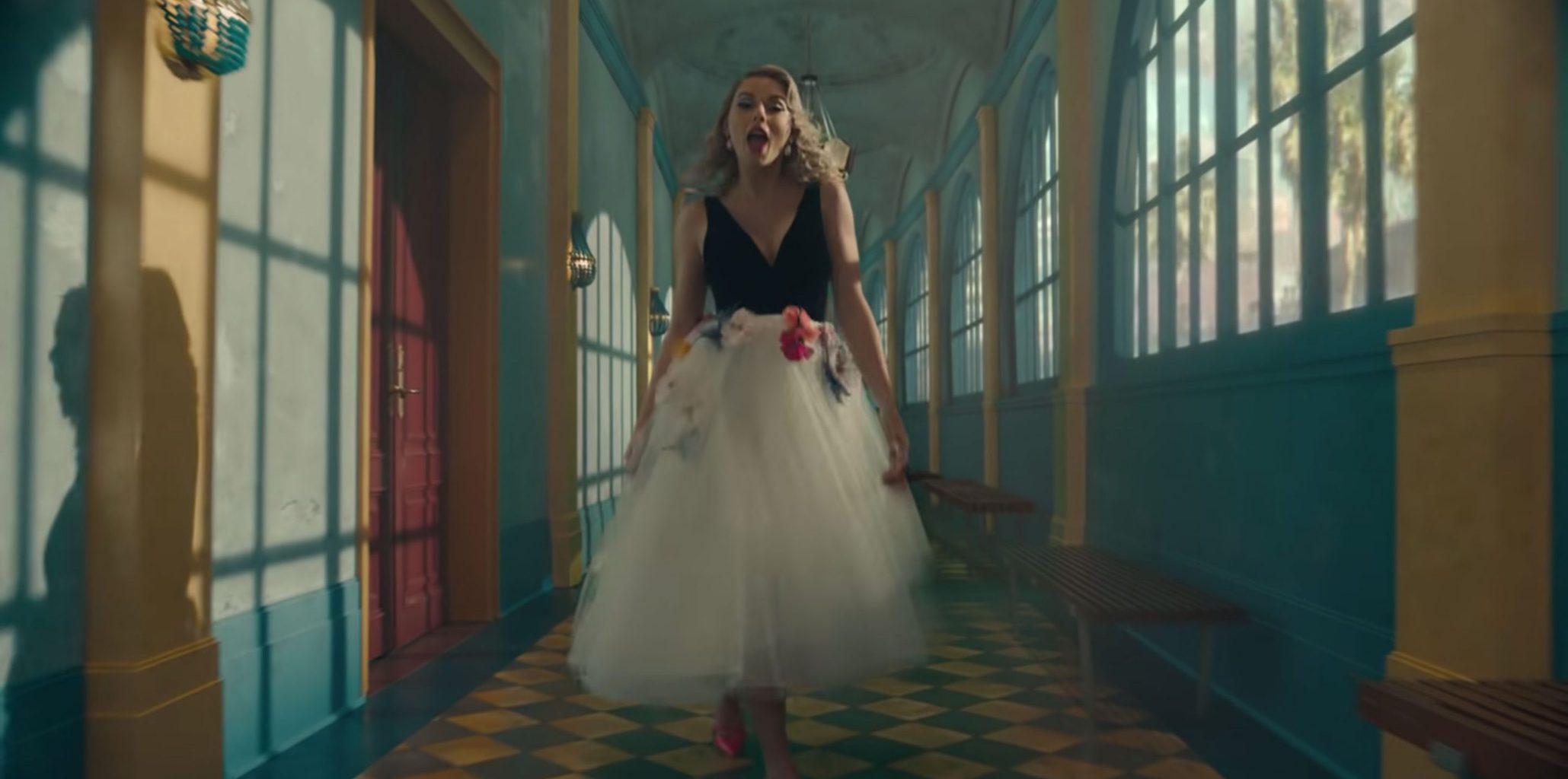 Taylor Swift in the Me music video wearing a tulle skirt and black top