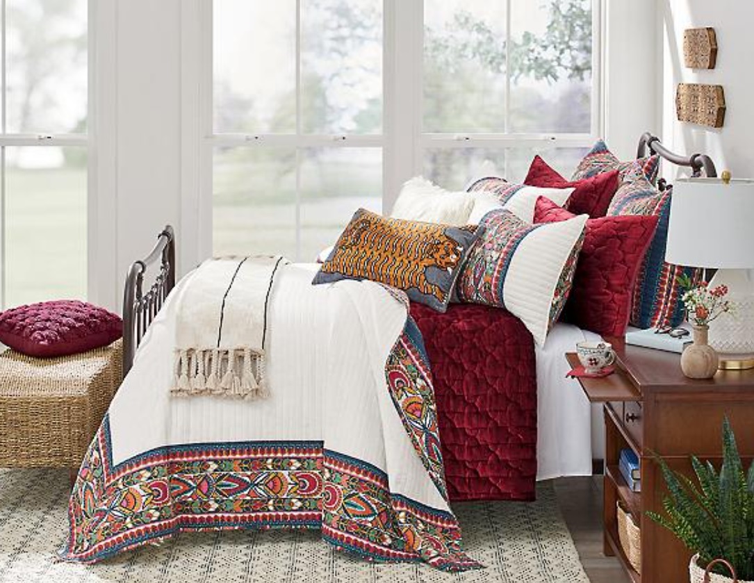 Cozy decor item: multi-colored pillows on bed