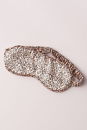 Silk leopard print eye mask on a gray background