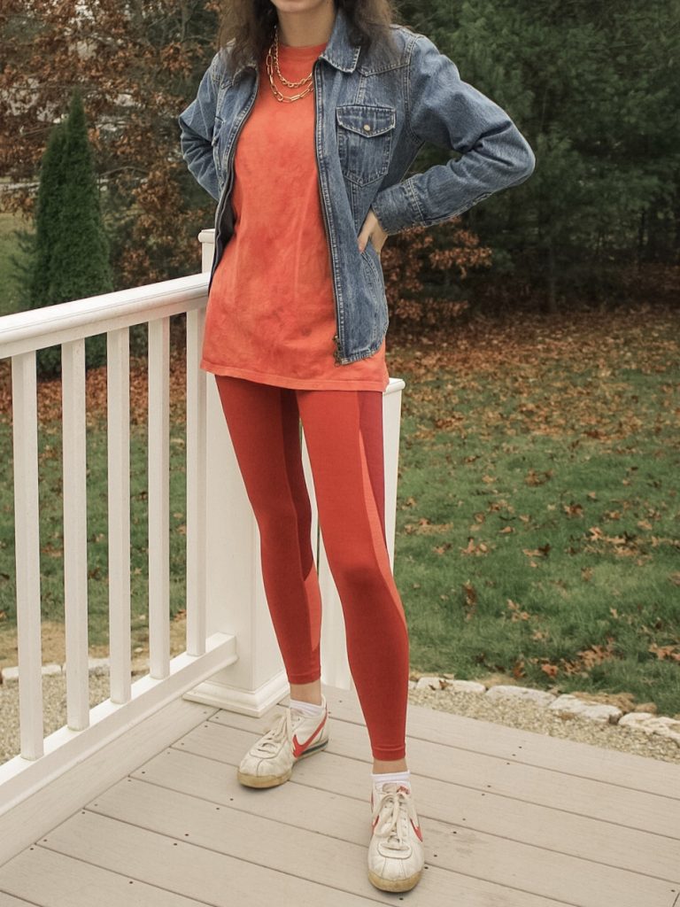 Photo of the author's outfit with orange leggings and a t-shirt