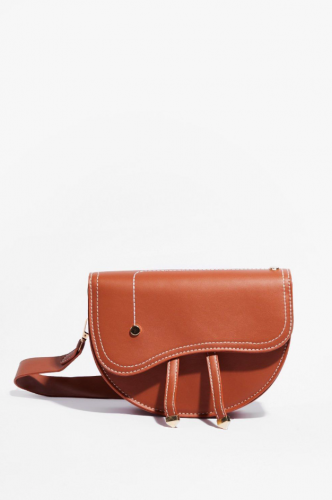 small brown saddle bag with asymmetrical flap from Nasty Gal