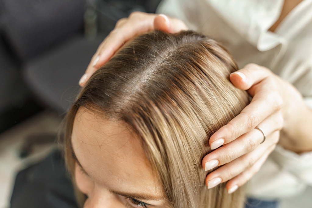 Parting her hair