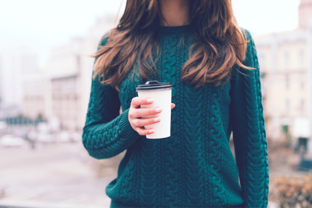 Woman holding a coffee