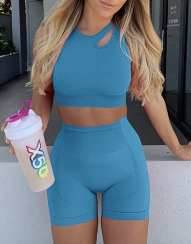 HYZ activewear outfit with blue cutout sports bra and biker shorts