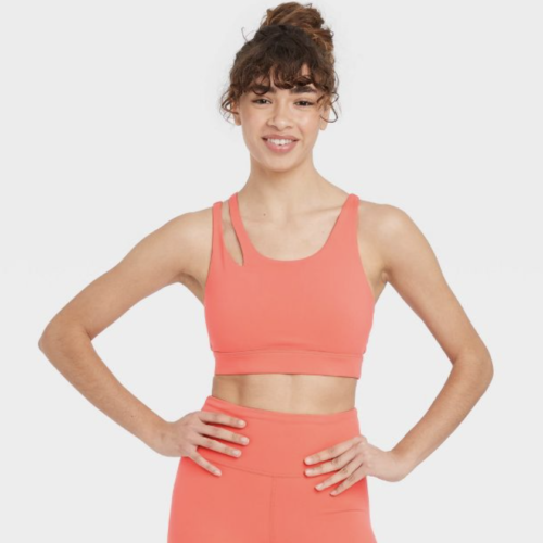 Electric coral workout set with asymmetrical bra straps and high-waisted leggings from JoyLab