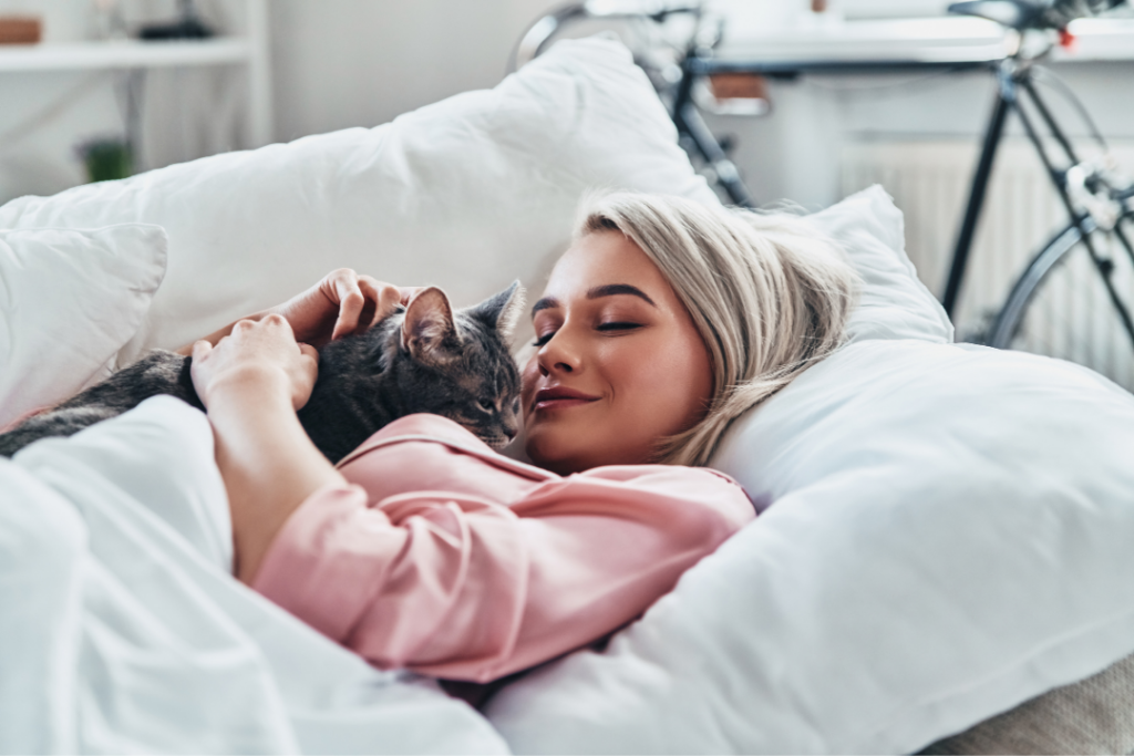 Woman cuddling with her cat