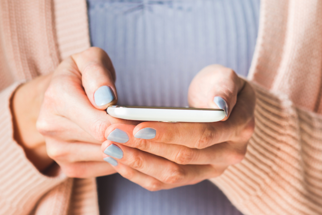 Woman holding cell phone