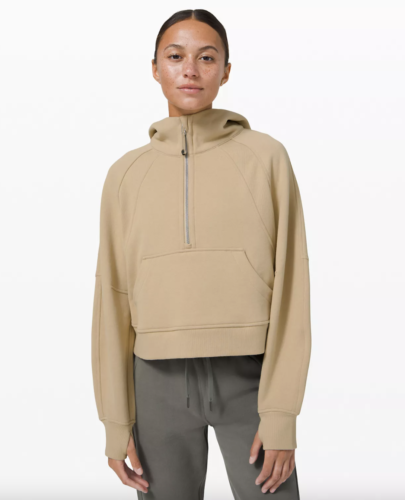 Lululemon shopping tips: light tan zip-up hoodie with hair tie attached to zipper.