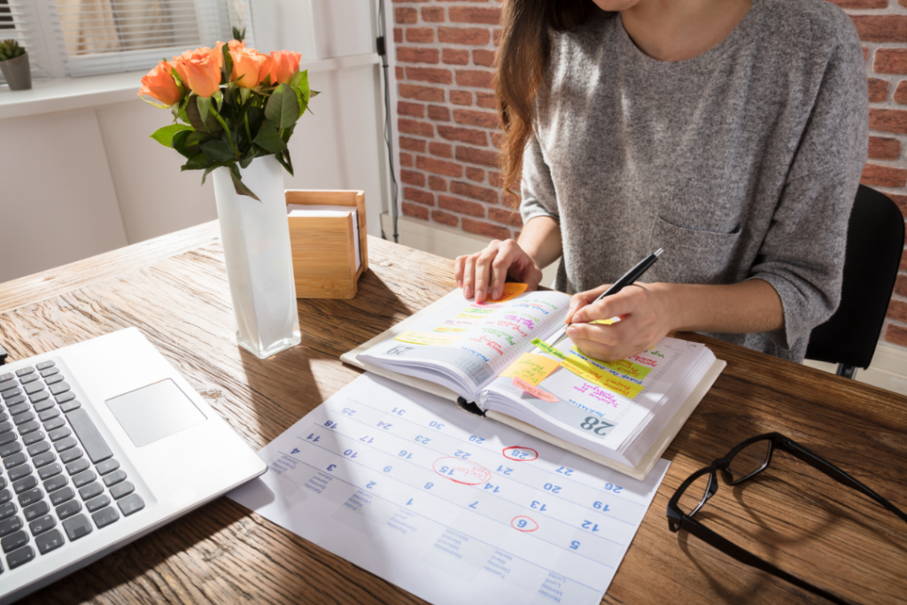 Woman writing down her schedule