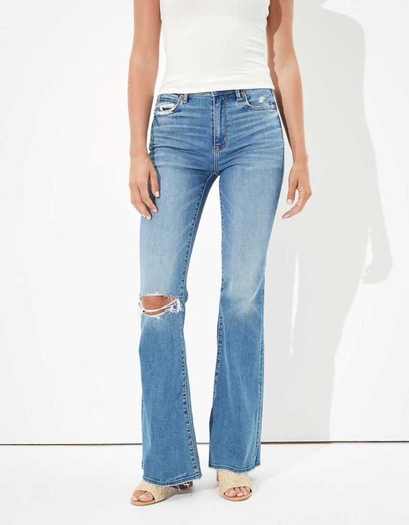 boho outfit ideas - Medium wash ripped flare jeans from AEO