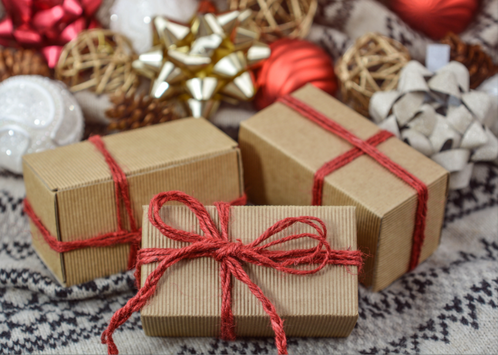 presents wrapped in brown paper with red rope bows