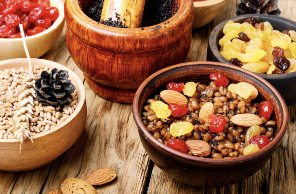 Bowls of nuts, grains, and dried fruit.