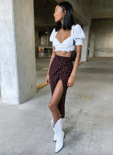 White peasant elastic trim crop top, black skirt with red dots and slit, white cowboy boots - fall date outfits