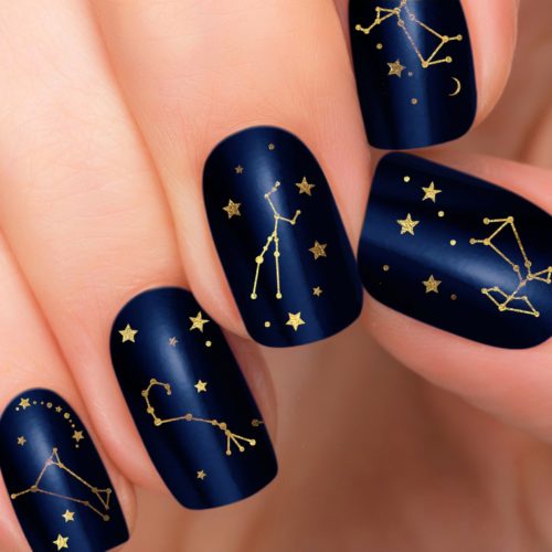 Astrology-inspired nails in navy and gold