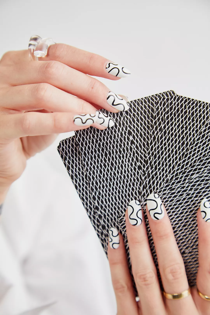 Black and white nails with a swirl design