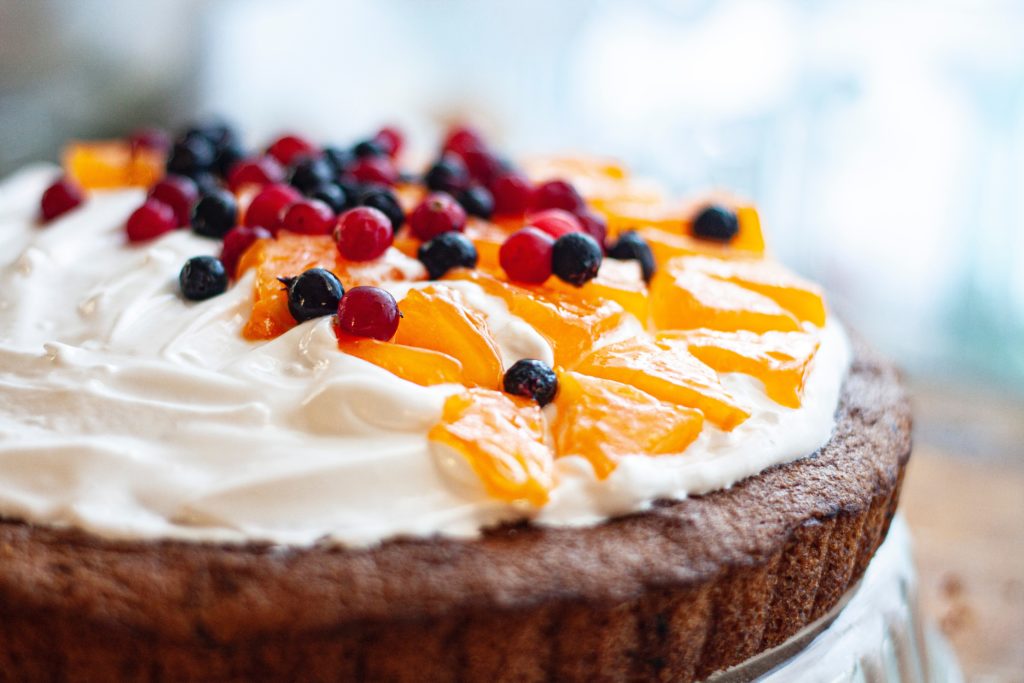 Cake with fruit on top.