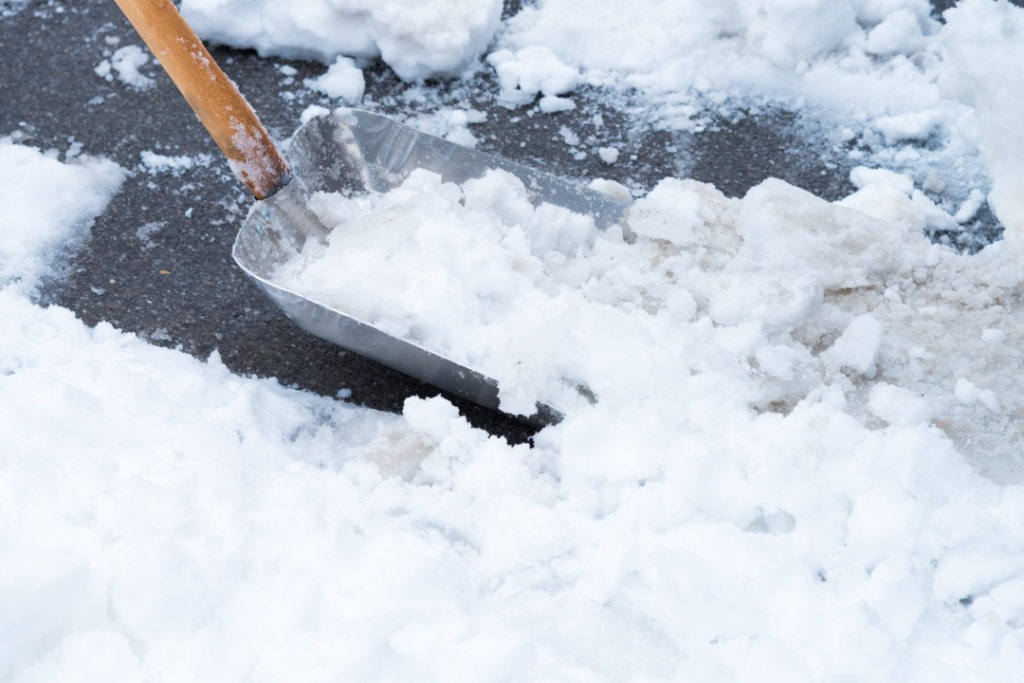 Photo of a shovel scooping up snow