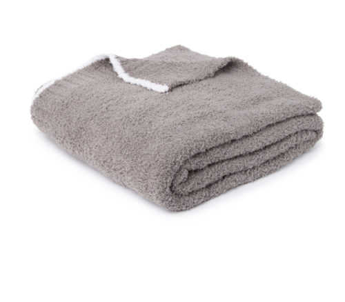 Photo of a fuzzy Barefoot Dreams Blanket in gray with white trim