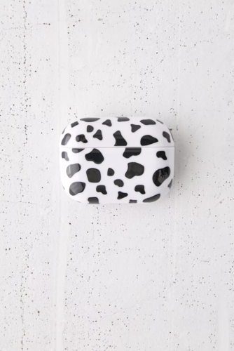 Cow print airpods case on a gray background