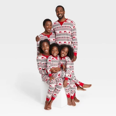 Photo of a family of five wearing red and white fair isle print holiday pajamas
