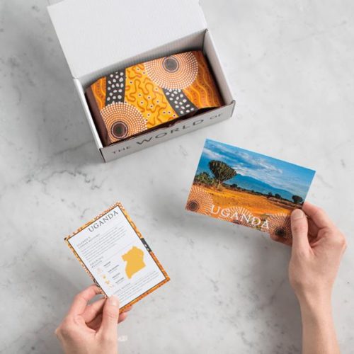 Photo of a monthly coffee subscription box with ground coffee and a postcard inside