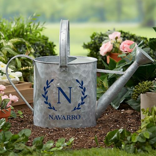 Personalized Watering Can with the letter N and the last name Navarro written in blue text on the front