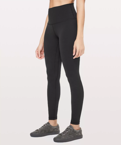 Photo of a model wearing the Lululemon Align pant in black and a pair of dark gray sneakers