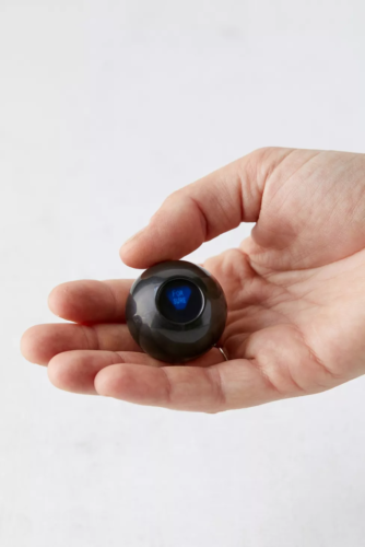 World's smallest magic 8 ball – photo of a tiny black Magic 8 ball taking up less than the palm of a hand