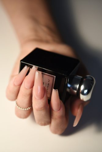 Long, coffin shaped nude fake nails from Etsy