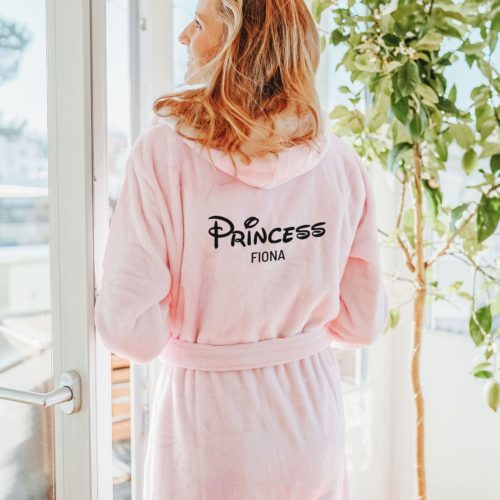 Pink fluffy bathrobe with the text Princess Fiona written on the back in Disney font