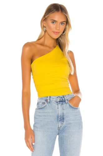 Revolve One Shoulder Yellow Top paired with light wash mom jeans