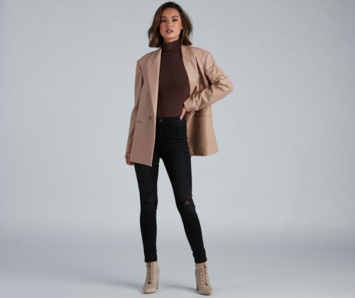 Winter bodysuit outfit with black skinny jeans, burgundy turtleneck bodysuit, oversized camel blazer, brown lace-up booties
