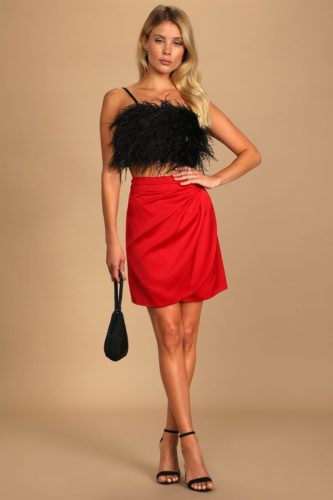 Lulus Trendy Outfit with red wrap skirt, faux feather cami crop top in black, and strappy black heels
