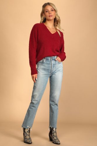 Simple look for Valentine's Day with red v-neck sweater, high waisted jeans, and snakeskin booties