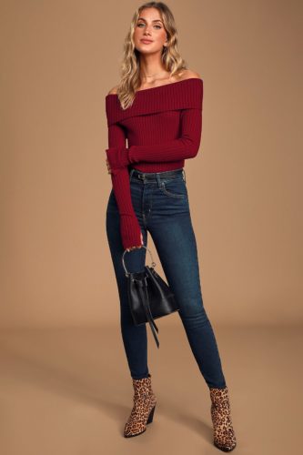 Lulus Off the Shoulder Top in burgundy paired with dark wash skinny jeans and leopard print booties, plus a small black fringe purse