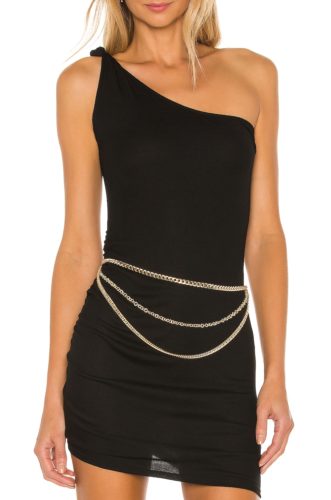 Revolve Chain Belt in yellow gold worn over a black one-shoulder mini dress