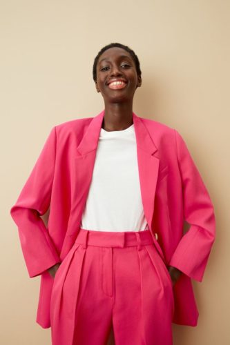 H&M hot pink blazer paired with hot pink pants