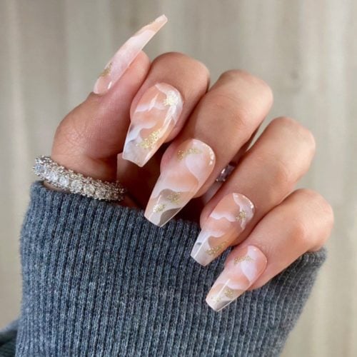 Nude marble coffin shaped nails with gold glitter accents